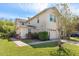 Charming townhouse with a two-car garage, manicured lawn, and lovely landscaping at 5565 Gelato Dr, Orlando, FL 32829