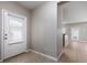 Bright foyer with neutral walls, ceramic tile floor, and a door with window at 5565 Gelato Dr, Orlando, FL 32829