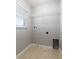 Compact laundry room with connections for a washer and dryer at 5565 Gelato Dr, Orlando, FL 32829