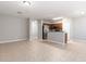 Open living area with modern kitchen, stainless steel appliances, and tile flooring at 5565 Gelato Dr, Orlando, FL 32829