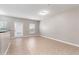Spacious living room with tile flooring, natural light, and an open floor plan at 5565 Gelato Dr, Orlando, FL 32829