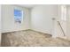 Upstairs bedroom features plush carpet and a window with natural light at 640 Trotters Dr, Eagle Lake, FL 33839