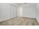 Bedroom with closet, carpeted flooring, and neutral paint offers a relaxing retreat at 640 Trotters Dr, Eagle Lake, FL 33839