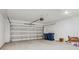 A spacious two-car garage features a modern door opener, ample storage, and a sealed concrete floor at 640 Trotters Dr, Eagle Lake, FL 33839