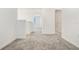 Hallway boasts modern design, plush carpet, and neutral paint scheme at 640 Trotters Dr, Eagle Lake, FL 33839