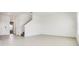Living room with tile floors, stairs and neutral walls at 640 Trotters Dr, Eagle Lake, FL 33839
