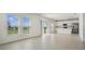 Open living area with tile flooring, natural light, and kitchen at 640 Trotters Dr, Eagle Lake, FL 33839