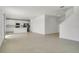 Spacious, open-concept living area with tile flooring adjacent to the kitchen at 640 Trotters Dr, Eagle Lake, FL 33839