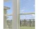 A clear window view of green and brown fields at 640 Trotters Dr, Eagle Lake, FL 33839