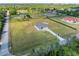 Aerial view of the home, shed, and landscaping highlights the property's size and location at 6607 Whispering Pines Rd, Orlando, FL 32824