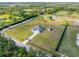 Sprawling property with a modern home, a large lawn, and a separate storage shed at 6607 Whispering Pines Rd, Orlando, FL 32824