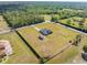 Expansive lot showcases the home, separate shed, and fenced yard within the property at 6607 Whispering Pines Rd, Orlando, FL 32824