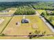 Home, shed, and enclosed backyard in an aerial perspective, showcasing property layout at 6607 Whispering Pines Rd, Orlando, FL 32824