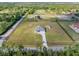 Aerial view shows the property outline, the house, shed, and outdoor space at 6607 Whispering Pines Rd, Orlando, FL 32824