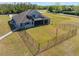A beautiful backyard featuring a large yard and partial view of the house at 6607 Whispering Pines Rd, Orlando, FL 32824