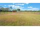 Fenced backyard offers a secure space, with a glimpse of the red shed at 6607 Whispering Pines Rd, Orlando, FL 32824