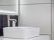 This bathroom features a close up of the sink with modern fixtures, beautiful tile and an open shower at 6607 Whispering Pines Rd, Orlando, FL 32824