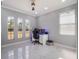 Well-lit bedroom with ample natural light from two large windows, and a clean, modern design at 6607 Whispering Pines Rd, Orlando, FL 32824