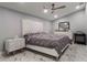 Modern bedroom featuring upholstered headboard, marble floors and ceiling fan at 6607 Whispering Pines Rd, Orlando, FL 32824