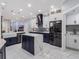 Modern kitchen with a large island, stainless steel appliances, and stylish cabinetry at 6607 Whispering Pines Rd, Orlando, FL 32824