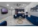 The living room features elegant tile flooring, recessed lighting, and stylish modern furniture at 6607 Whispering Pines Rd, Orlando, FL 32824
