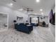 Spacious living room offers modern lighting, elegant tile flooring, and sophisticated furnishings at 6607 Whispering Pines Rd, Orlando, FL 32824