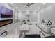 Bright living room with marble floors, a modern fireplace, and comfortable white leather seating at 6607 Whispering Pines Rd, Orlando, FL 32824
