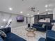 The living room features elegant tile flooring, recessed lighting, and stylish modern furniture at 6607 Whispering Pines Rd, Orlando, FL 32824