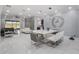 Open concept living area with dining room, living room, and kitchen with modern decor and finishes at 6607 Whispering Pines Rd, Orlando, FL 32824