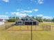 Back exterior featuring an upper and lower deck and a fenced-in yard for outdoor enjoyment at 6607 Whispering Pines Rd, Orlando, FL 32824