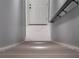 View of basement staircase leading up to a white door, highlighting the clean lines and bright, modern design at 6607 Whispering Pines Rd, Orlando, FL 32824