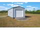 Modern storage shed offers extra storage space, with a ramp for easy access at 6607 Whispering Pines Rd, Orlando, FL 32824
