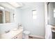 Light bathroom with a single sink vanity and glass shower at 726 Viking Ave, Tavares, FL 32778