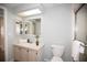 Cozy bathroom with ample lighting, vanity, and updated features at 726 Viking Ave, Tavares, FL 32778