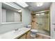 This bathroom features a walk-in shower, vanity, and tiled walls for a comfortable experience at 726 Viking Ave, Tavares, FL 32778