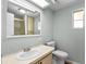 The bathroom offers a vanity with a sink, a toilet, and a shower/tub combination for convenience at 726 Viking Ave, Tavares, FL 32778