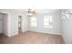 Spacious bedroom with wood-look flooring and natural light from windows at 726 Viking Ave, Tavares, FL 32778