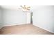 Bright bedroom features light walls and modern wood-look flooring at 726 Viking Ave, Tavares, FL 32778