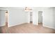 Spacious bedroom boasts modern flooring, light walls and two entryways at 726 Viking Ave, Tavares, FL 32778