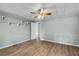 The bedroom provides plenty of space, wood-look flooring, and natural light, perfect for relaxing at 726 Viking Ave, Tavares, FL 32778