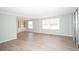 Inviting living room featuring stylish flooring and ample natural light at 726 Viking Ave, Tavares, FL 32778