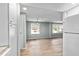 Open-concept living area with neutral walls, laminate flooring, and plenty of natural light, ideal for relaxation at 726 Viking Ave, Tavares, FL 32778