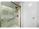 The walk-in shower is accessible and features tiled walls and a handheld shower head for convenience at 726 Viking Ave, Tavares, FL 32778