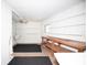 Storage room with workbench, utility sink, ceiling fan and ample shelving at 726 Viking Ave, Tavares, FL 32778