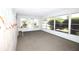 Bright sun room with large windows providing lots of natural light at 726 Viking Ave, Tavares, FL 32778