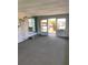 The sunroom features ample windows, an air conditioner, and a sliding glass door at 726 Viking Ave, Tavares, FL 32778