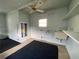 Functional utility room with water heater, utility sink, pegboard walls, and ceiling fan at 726 Viking Ave, Tavares, FL 32778