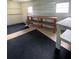 Interior view of the workshop, with ample shelving and work benches, great for hobbies at 726 Viking Ave, Tavares, FL 32778