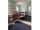 Interior view of the workshop with shelving and work benches, perfect for home projects at 726 Viking Ave, Tavares, FL 32778
