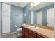 Bathroom featuring a walk-in shower, vanity with sink, and a mirror at 8029 Acadia Estates Ct, Kissimmee, FL 34747